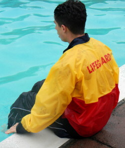 pool lifeguard dressed in anorak